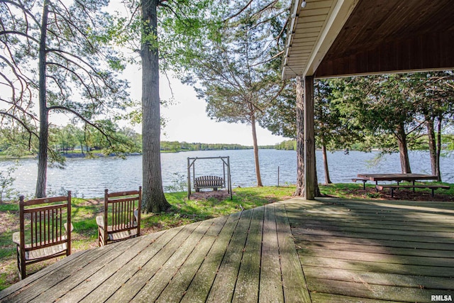 wooden deck featuring a water view