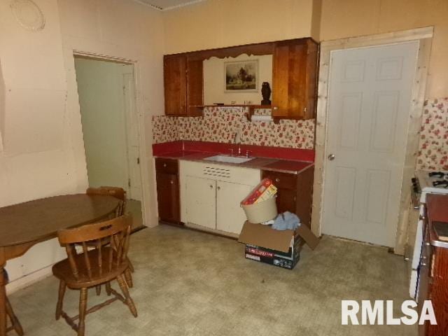 200 3rd St, Rosiclare, IL 62982 - kitchen featuring white cabinetry and a sink