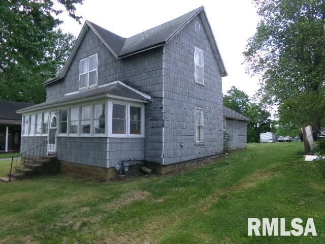 200 3rd St, Rosiclare, IL 62982 - view of side of home with a lawn and entry steps