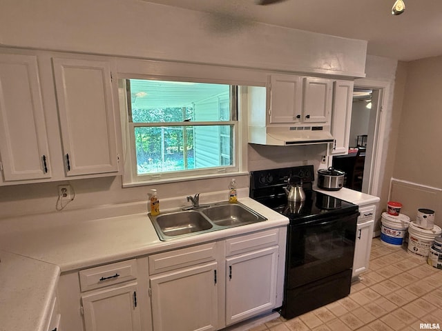 206 W 16th St, Metropolis, IL 62960 - kitchen featuring black / electric stove, under cabinet range hood, and white cabinets