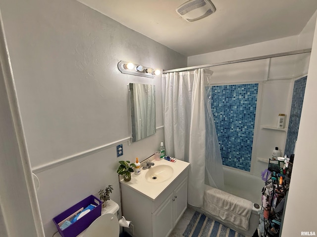bathroom featuring tile patterned flooring, visible vents, shower / tub combo, and vanity