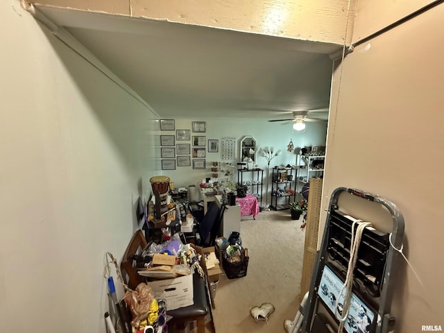 interior space with ceiling fan
