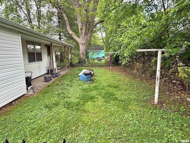 view of yard with a patio and fence