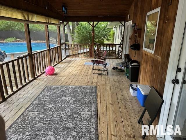 wooden deck with an outdoor pool