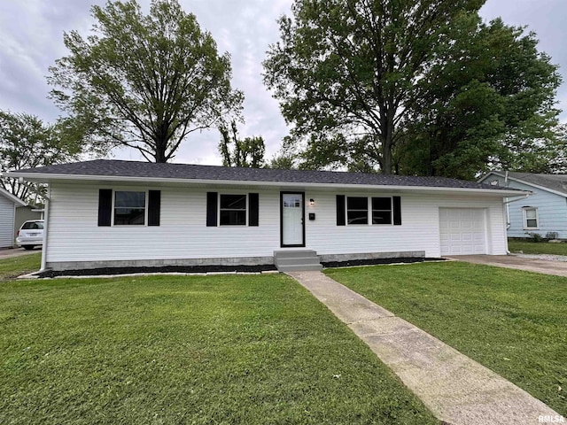 ranch-style home featuring an attached garage, driveway, and a front lawn