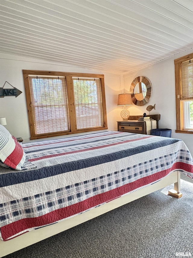 bedroom featuring wood ceiling