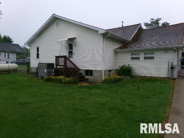 217 Trammel Rd, Carrier Mills, IL 62917 - back of house featuring a yard and central AC