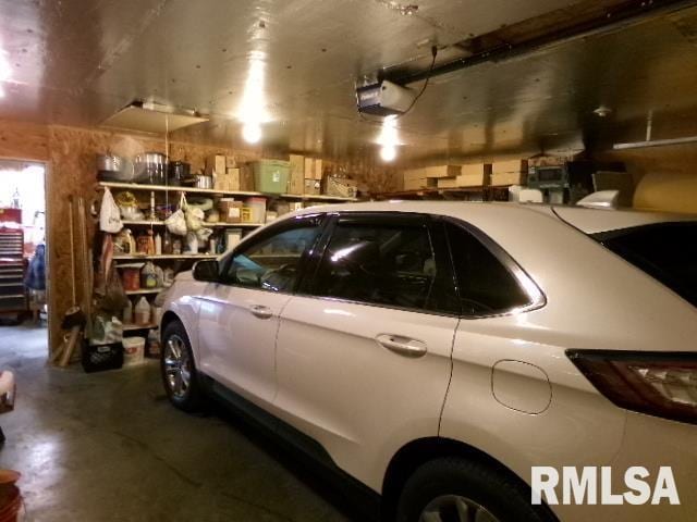 217 Trammel Rd, Carrier Mills, IL 62917 - garage featuring a garage door opener