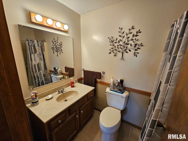 16123 N Hickory Ln, Woodlawn, IL 62898 - bathroom with vanity, toilet, tile patterned floors, a textured ceiling, and a shower with shower curtain