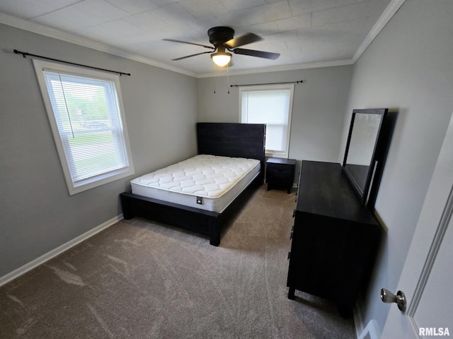 bedroom featuring carpet floors, baseboards, ornamental molding, and ceiling fan