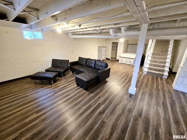 living area featuring stairs and wood finished floors