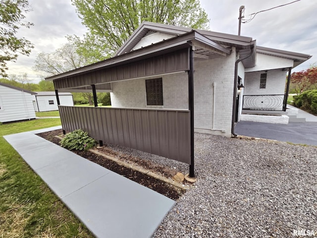 view of side of home with brick siding