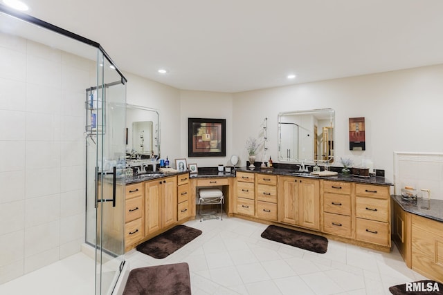 bathroom featuring vanity, a stall shower, and recessed lighting