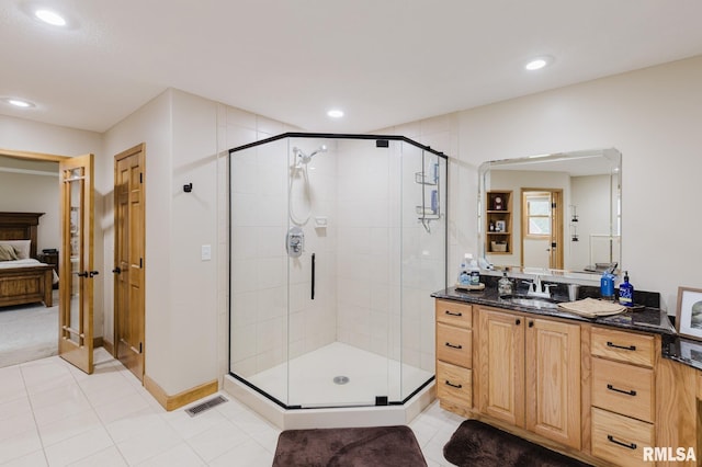 ensuite bathroom featuring ensuite bath, tile patterned flooring, a stall shower, vanity, and recessed lighting