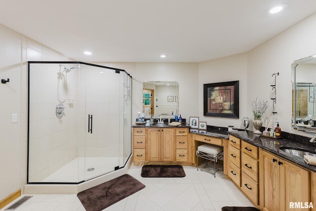 bathroom with vanity, recessed lighting, visible vents, and a stall shower