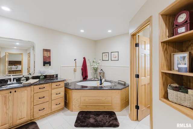 full bath with recessed lighting, tile patterned floors, a garden tub, and vanity