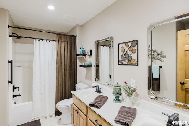 full bathroom featuring double vanity, shower / bath combination with curtain, a sink, tile patterned floors, and toilet