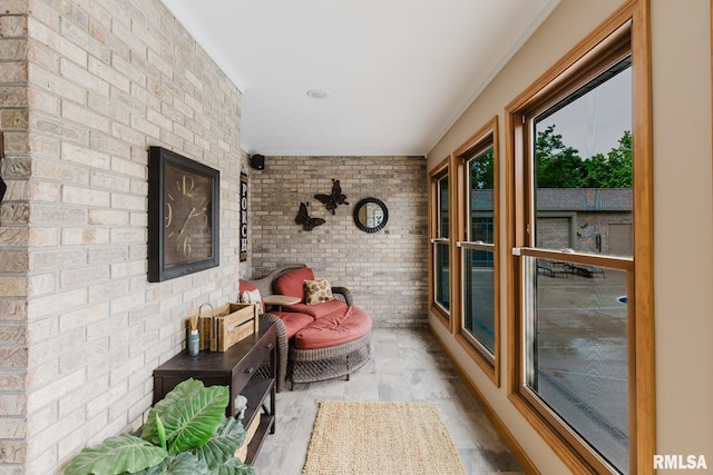 sunroom with brick wall