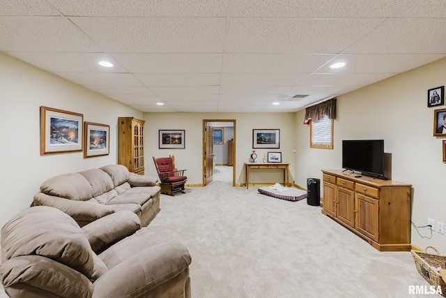 living area with baseboards, light carpet, recessed lighting, and a paneled ceiling