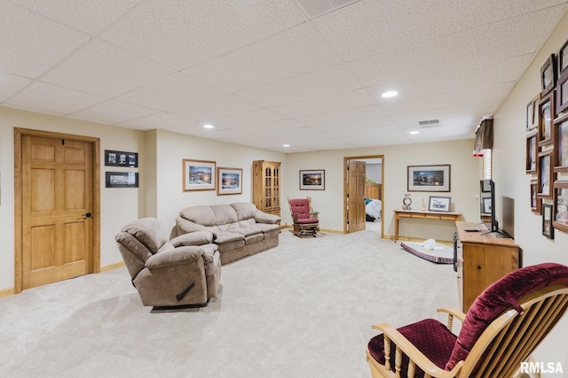 living room with carpet floors, recessed lighting, baseboards, a drop ceiling, and visible vents