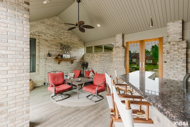 view of patio / terrace featuring ceiling fan and french doors