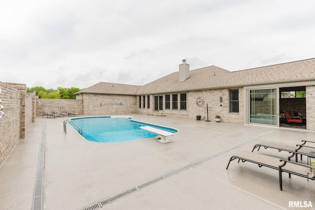 view of pool featuring a fenced backyard, a fenced in pool, and a patio area