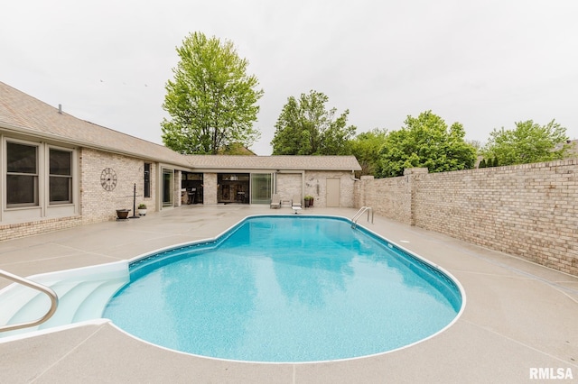view of pool featuring a fenced in pool, a patio, and a fenced backyard
