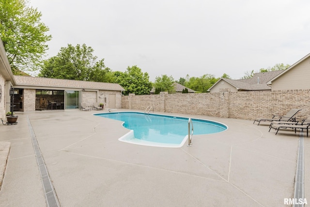 view of swimming pool with a fenced in pool, a patio, and a fenced backyard
