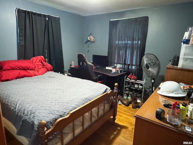 bedroom with wood finished floors