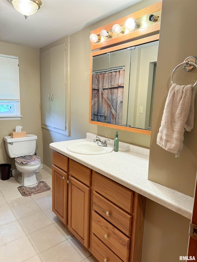 full bathroom with vanity, tile patterned floors, toilet, and curtained shower