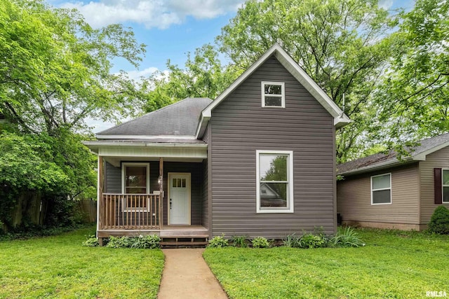 2016 Division St, Murphysboro, IL 62966 - bungalow featuring covered porch, roof with shingles, and a front yard
