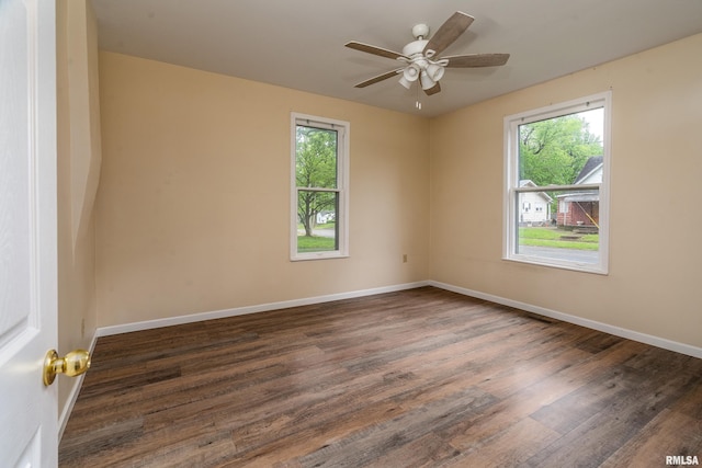 2016 Division St, Murphysboro, IL 62966 - unfurnished room with baseboards, a ceiling fan, and wood finished floors