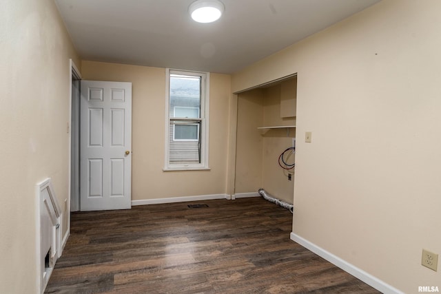2016 Division St, Murphysboro, IL 62966 - clothes washing area featuring dark wood finished floors and baseboards
