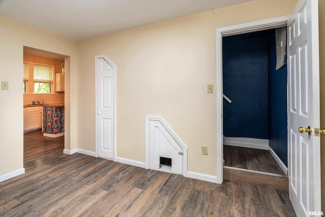 2016 Division St, Murphysboro, IL 62966 - unfurnished room featuring baseboards and dark wood-style floors