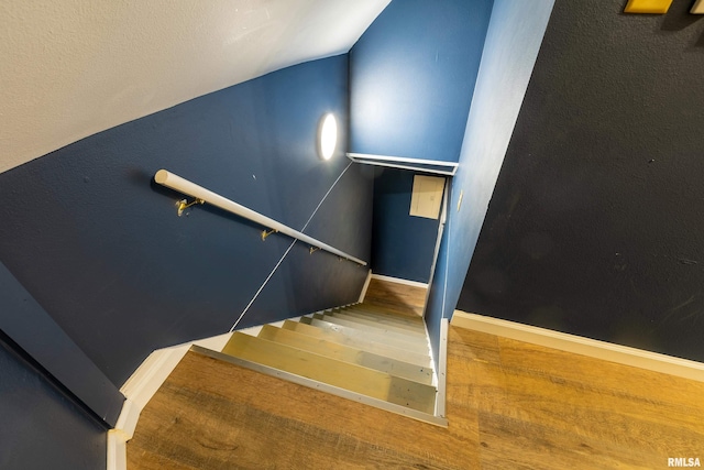 2016 Division St, Murphysboro, IL 62966 - staircase featuring baseboards, vaulted ceiling, and wood finished floors