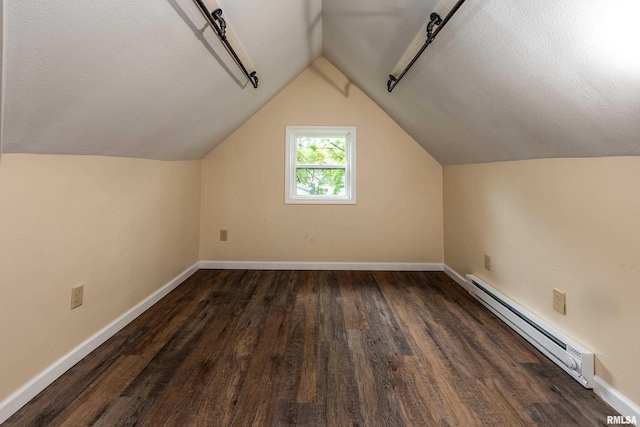 2016 Division St, Murphysboro, IL 62966 - additional living space with wood finished floors, baseboards, a baseboard heating unit, and lofted ceiling