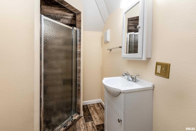 2016 Division St, Murphysboro, IL 62966 - bathroom featuring a stall shower, vanity, and wood finished floors