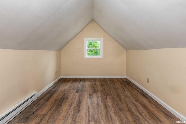 2016 Division St, Murphysboro, IL 62966 - additional living space with baseboards, vaulted ceiling, a baseboard radiator, and dark wood-type flooring