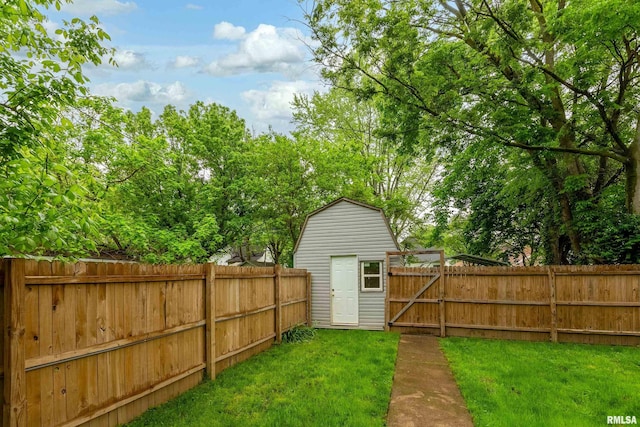 2016 Division St, Murphysboro, IL 62966 - view of yard with a fenced backyard, an outdoor structure, and a shed