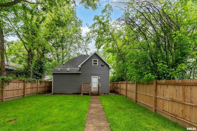 2016 Division St, Murphysboro, IL 62966 - exterior space featuring a shingled roof, a yard, and a fenced backyard