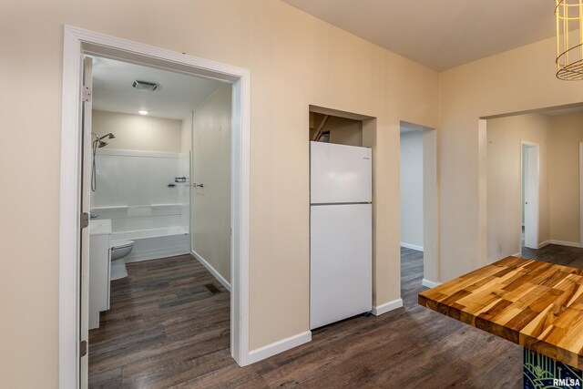 2016 Division St, Murphysboro, IL 62966 - hall with baseboards, dark wood-style floors, and visible vents