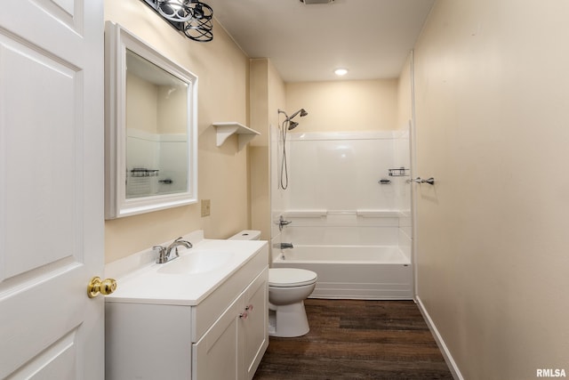 2016 Division St, Murphysboro, IL 62966 - bathroom with vanity, toilet, shower / tub combination, and wood finished floors