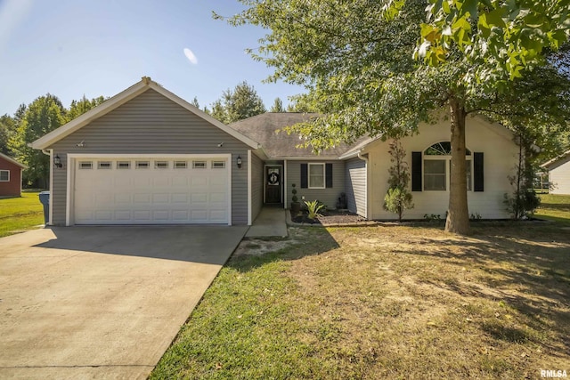 ranch-style home featuring concrete driveway, a front yard, and a garage
