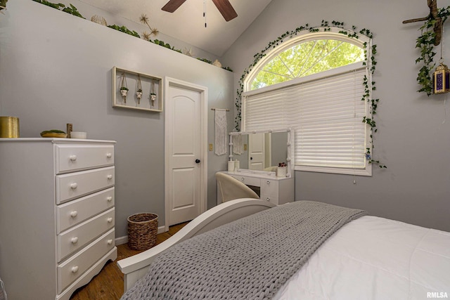 bedroom with wood finished floors, lofted ceiling, and ceiling fan