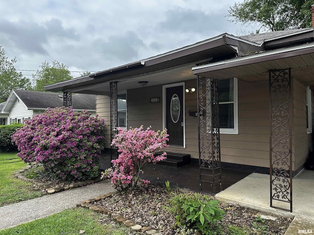 single story home featuring covered porch