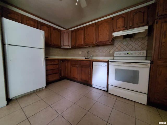 1027 W Laurel St, Carbondale, IL 62901 - kitchen with light tile patterned flooring, ceiling fan, white appliances, light countertops, and under cabinet range hood
