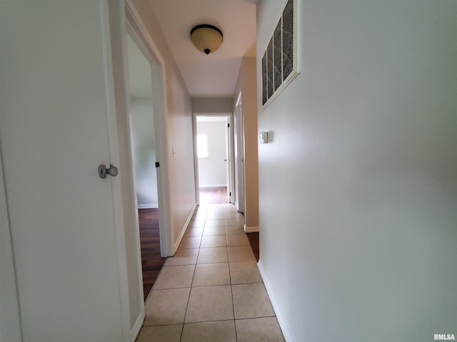 1027 W Laurel St, Carbondale, IL 62901 - corridor featuring baseboards, visible vents, and light tile patterned flooring