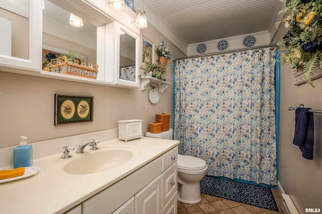 24 Karen Dr, Christopher, IL 62822 - full bathroom with toilet, a shower with curtain, tile patterned floors, a baseboard heating unit, and vanity