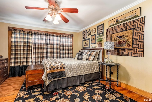 24 Karen Dr, Christopher, IL 62822 - bedroom with baseboards, crown molding, a ceiling fan, and wood finished floors