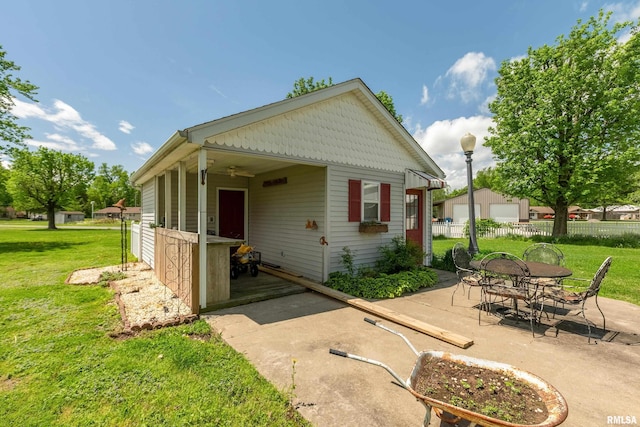 24 Karen Dr, Christopher, IL 62822 - rear view of property featuring a yard, a patio area, and fence